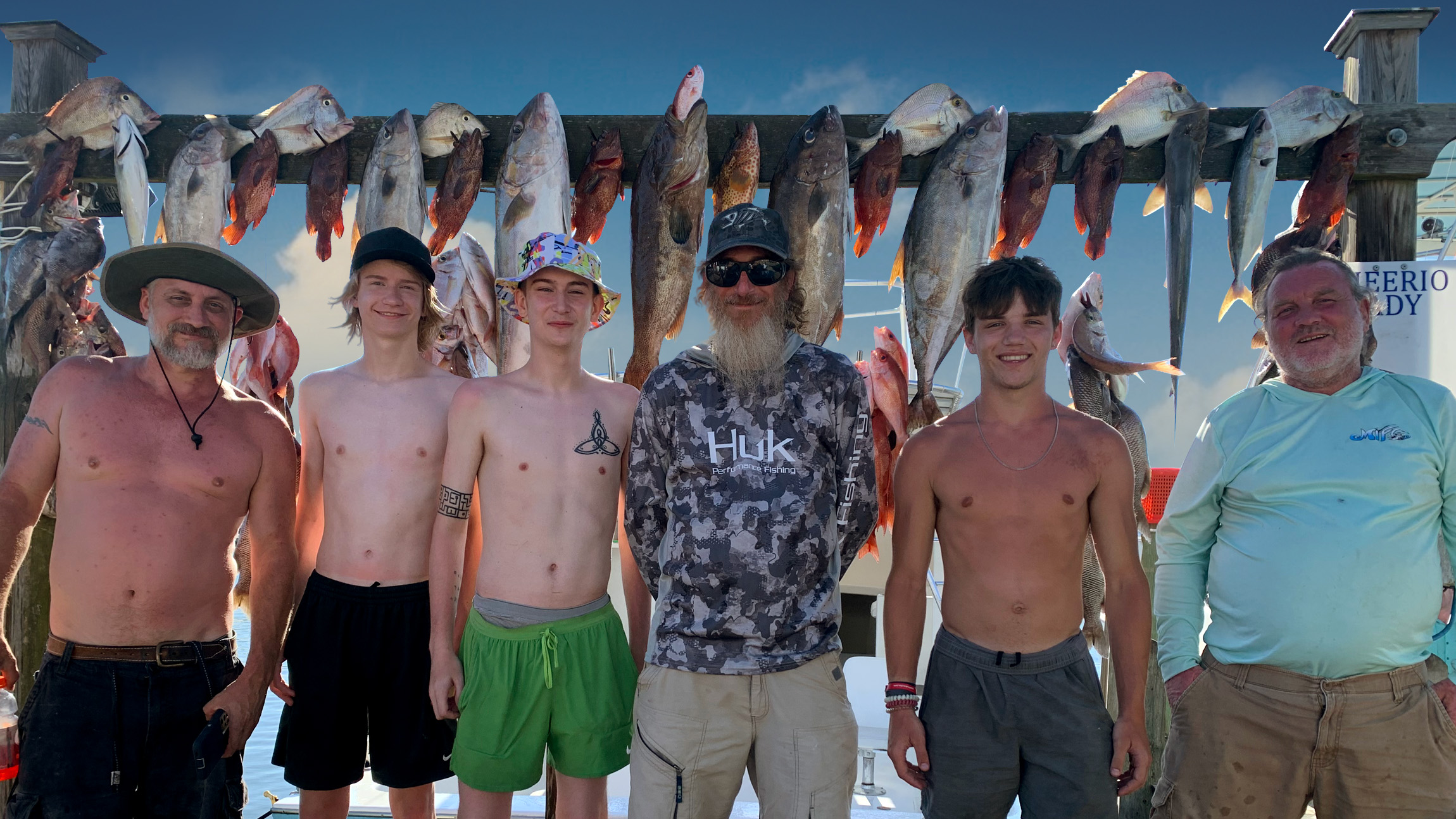 Anglers fighting a fish on the stern of the Cheerio Lady